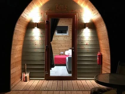 Doorway at Night time Cosy Camping with Light, heating and electricity